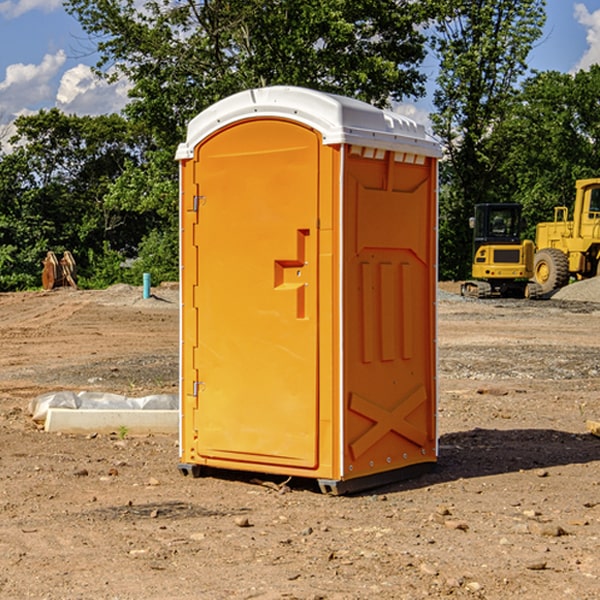 what is the cost difference between standard and deluxe portable restroom rentals in Bluemont